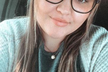 Photo of young woman with glasses
